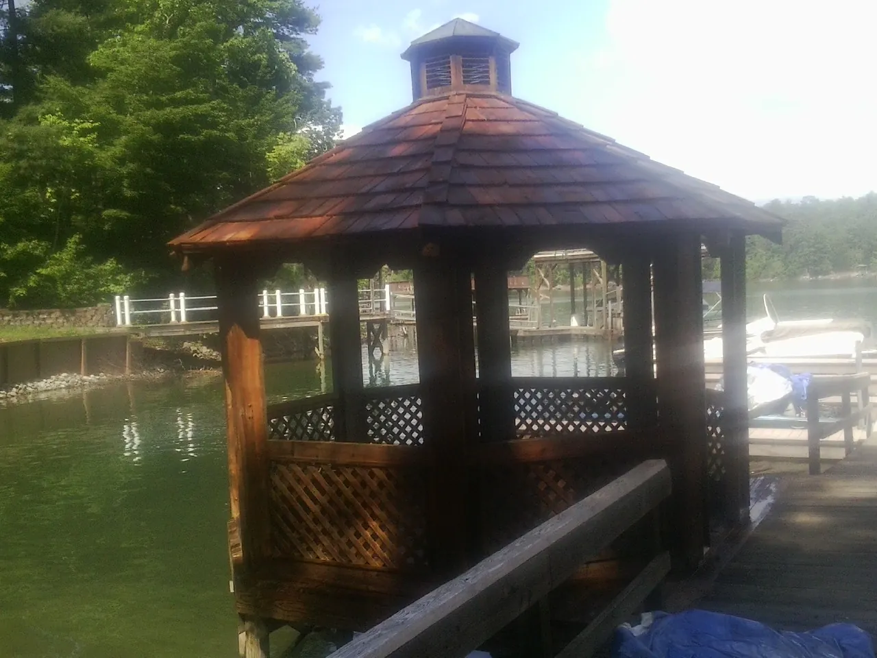 Cedar shake gazebo roof rebuilt on a lake dock in Wellston